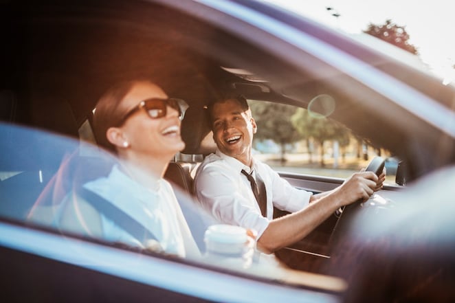 Man driving with a woman passenger
