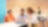Team collaboration around a laptop in a modern office setting