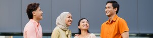 Diverse professionals networking outside a modern corporate building