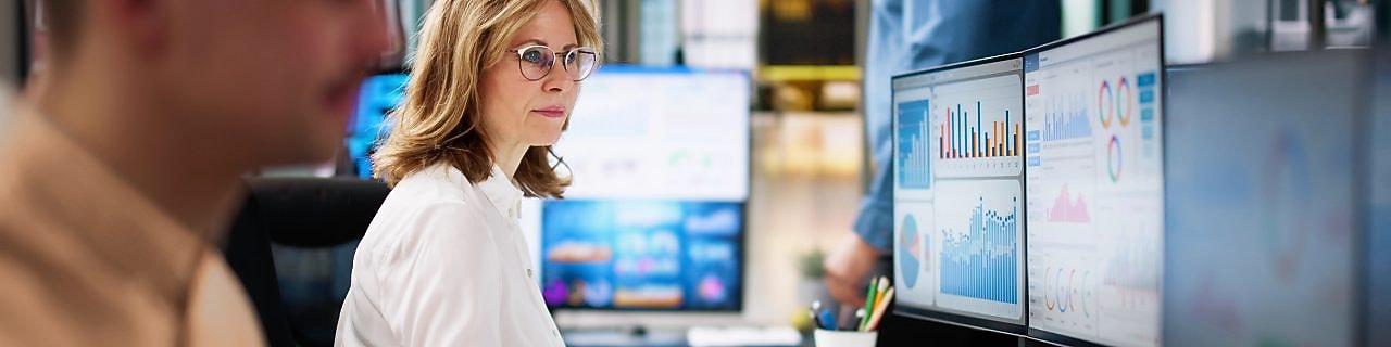 Office scene with employees working at desks