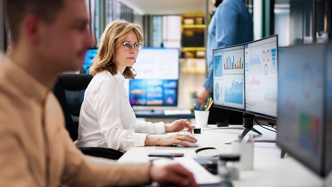 Office scene with employees working at desks