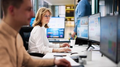 Office scene with employees working at desks