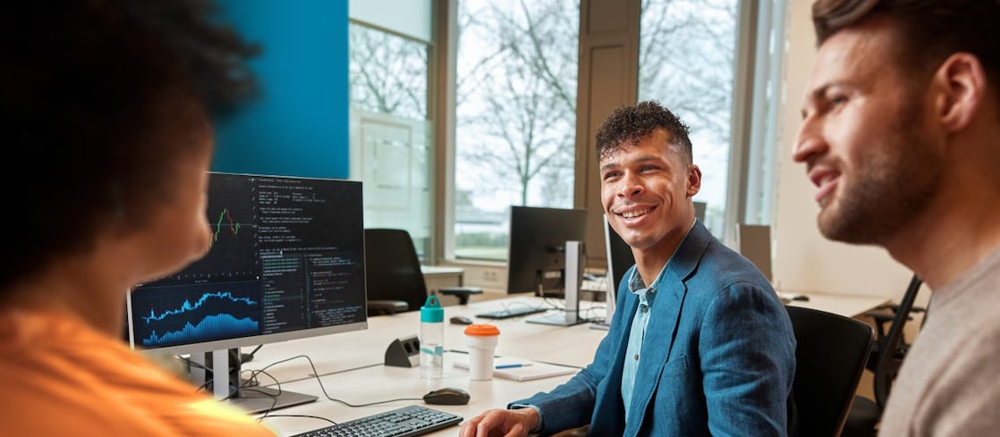 Team discussing data visualizations in office