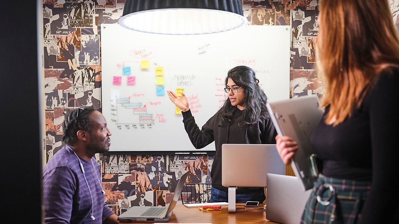 Three employees having in a meeting room