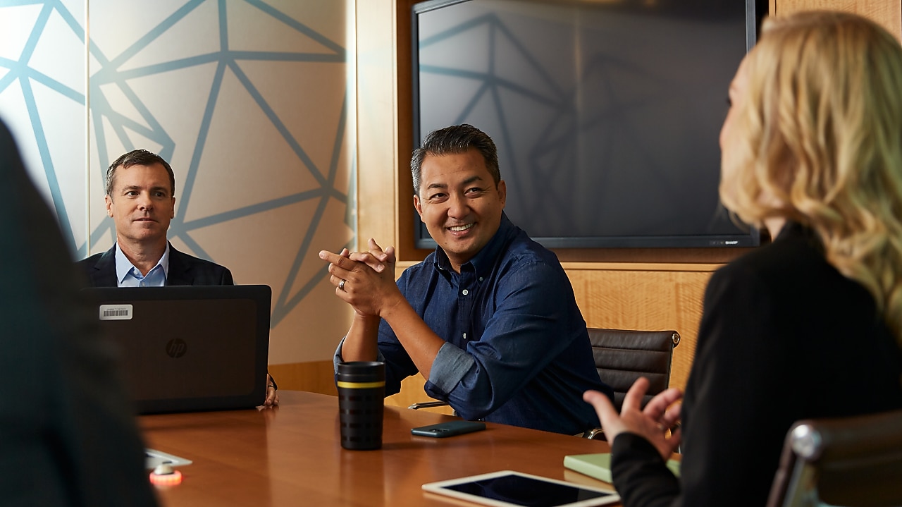 Several employees meeting in a conference room