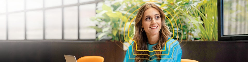 A female Shell Graduate employee in her element as she works on her laptop.
