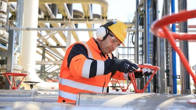 Engineer working on a pipeline