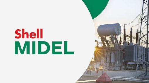 Transformator na tle zachodzącego słońca. Po lewej stronie na jasnoszarym tle widnieją słowa "Shell MIDEL".