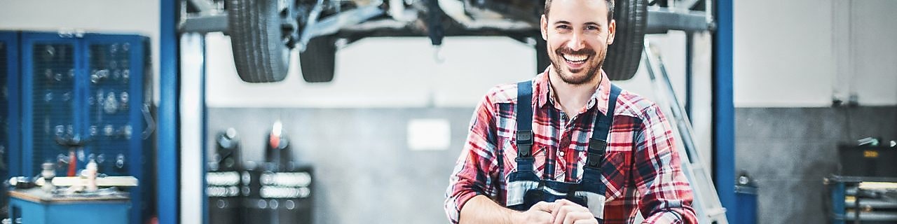 Shutterstock two worker reparing the car