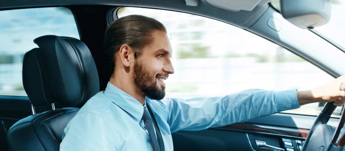 man driving a car