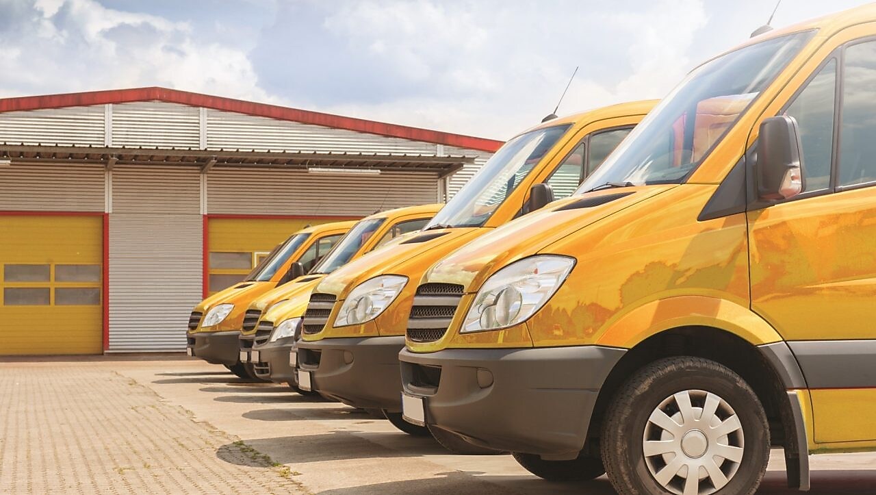 Yellow vans parked