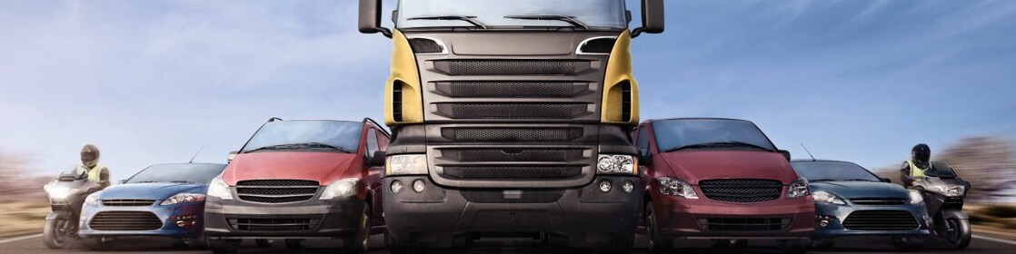 Cars and trucks in line on the road