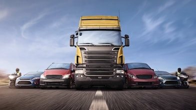 Cars and trucks in line on the road