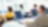 rear view of four business executives using computers in an office