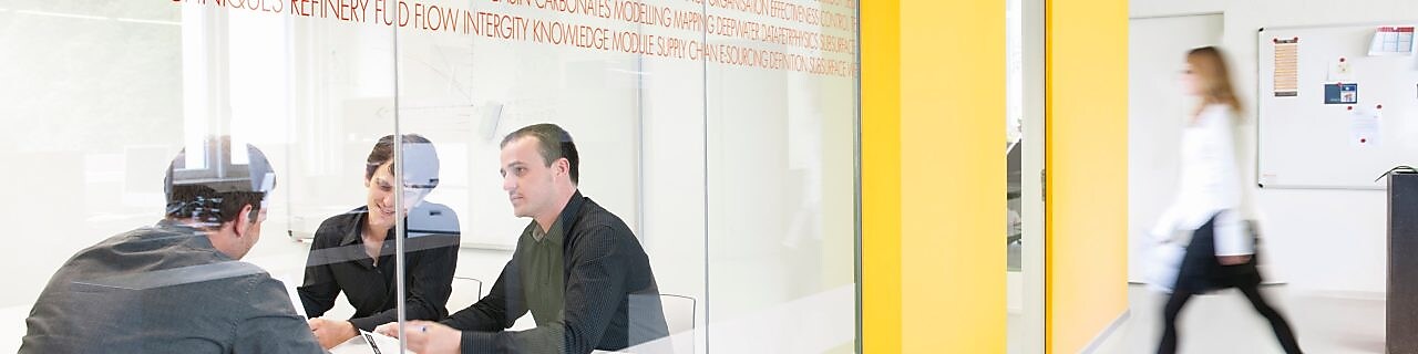 Employees inside a conference room
