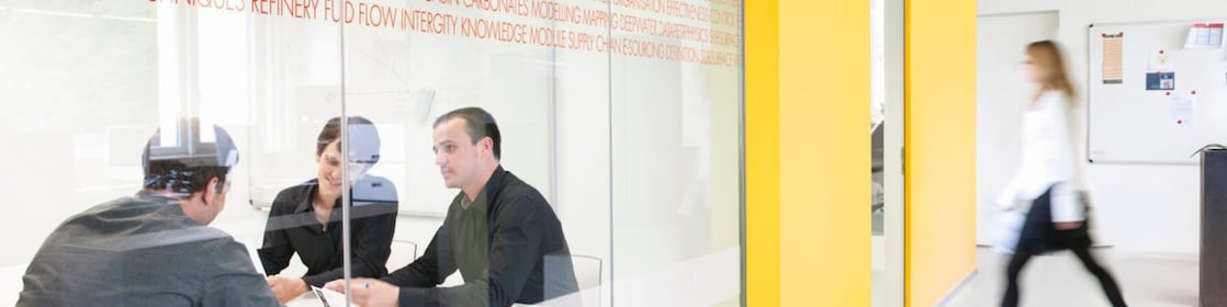 Employees inside a conference room