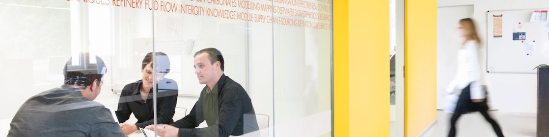 Employees inside a conference room