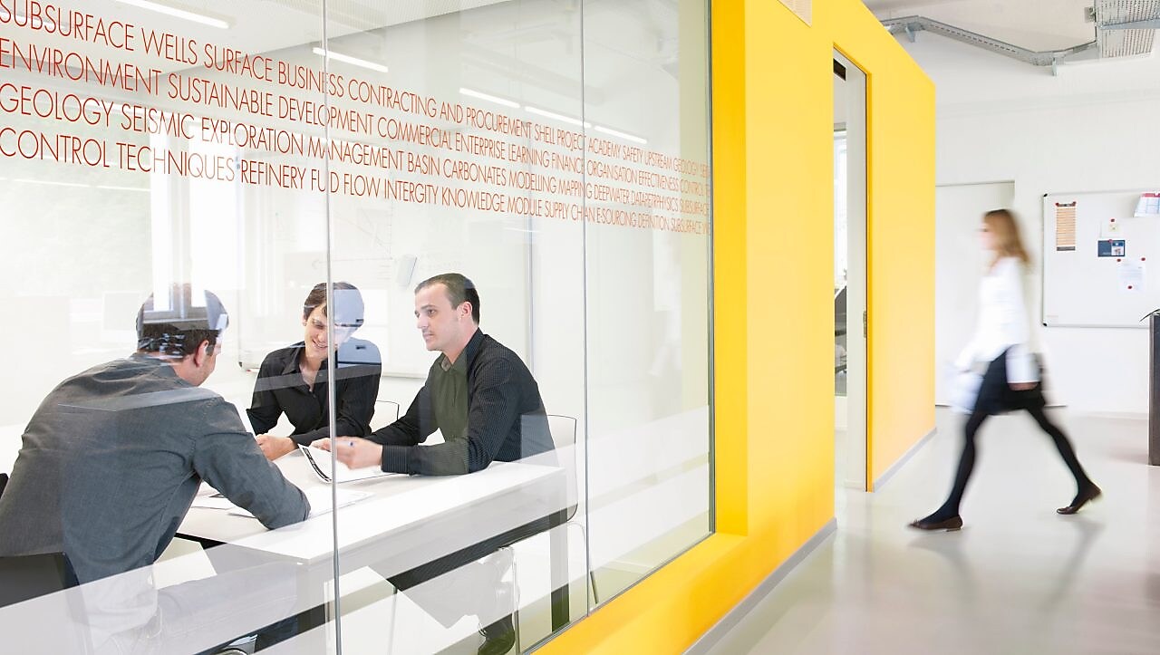Employees inside a conference room