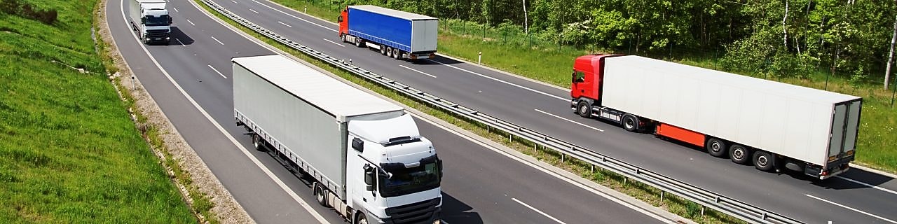 Truck on highway near mountain