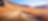 Deserted dirt road running through a mountainous valley