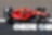 Czerwone Scuderia Ferrari stoi na torze wyścigowym - przykład innowacyjnej współpracy z Shell Helix Ultra