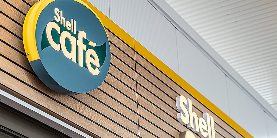 Shell Café logo on Shell station facade