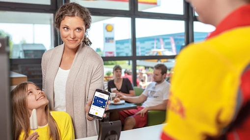 Women in the car showing clubsmart card