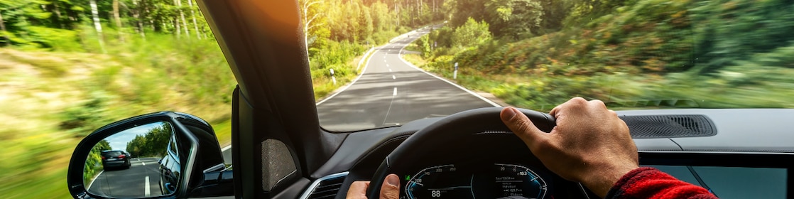 Dashboard of car with road ahead