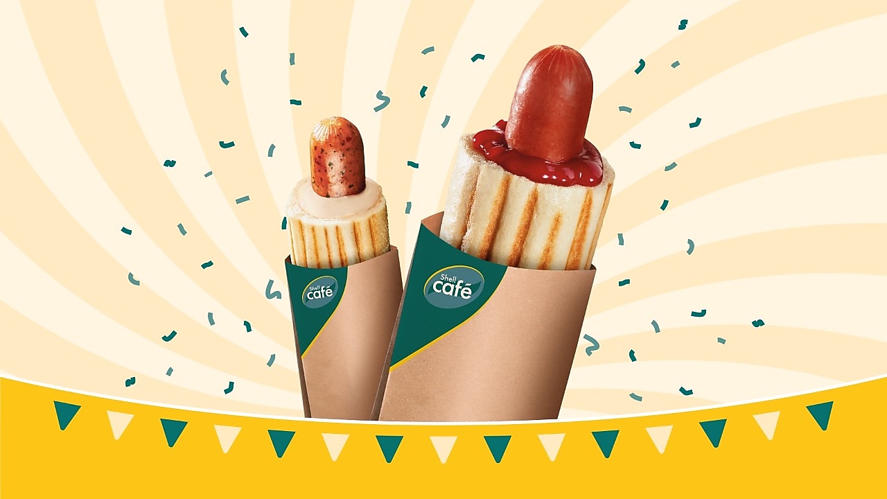 Grafika przedstawiająca dwa hot dogi z opisem Duży Hot dog w cenie małego!